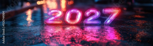 Neon numbers 2027 are displayed on a wet surface in the rain, new year 2027