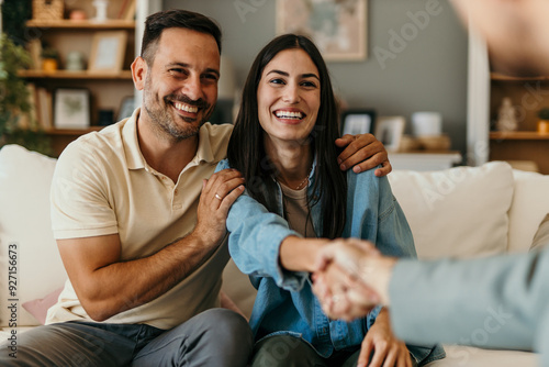 Happy man and woman clients handshake close deal or close the agreement with a real estate agent