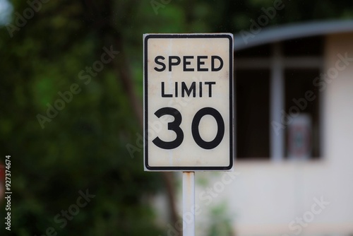 speed limit sign post on a roadside close up