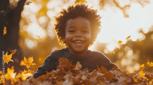 Curly-haired child concentrating on autumn crafts, surrounded by warm colors, expressing creativity.