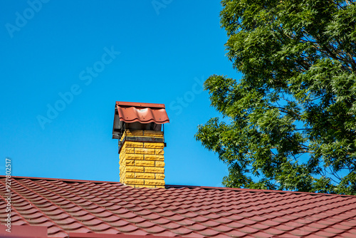 Exhaust pipe on the roof of the house for smoke extraction..