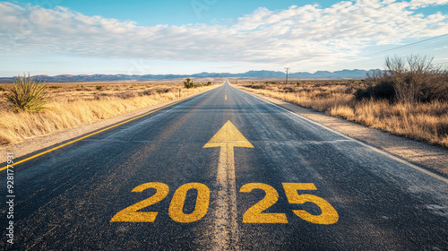 Road to 2025 with an empty road with written 2025 and arrow pointing towards the horizon to represent the future and positivity and success of the new year 2025