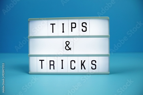 Tips & Tricks letterboard text on LED Lightbox on blue background