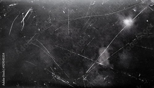 Dusty scratched and scanned old film texture with cracks; dirty grunge style overlay for photo or banner