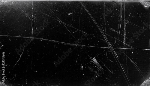 Dusty scratched and scanned old film texture with cracks; dirty grunge style overlay for photo or banner