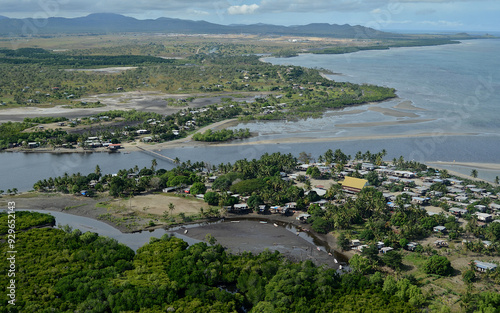 Aerial view small village of Lea Lea with crossover bridge on the delta lands Papua New Guinea.