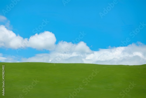 Minimalist green hill and blue sky.