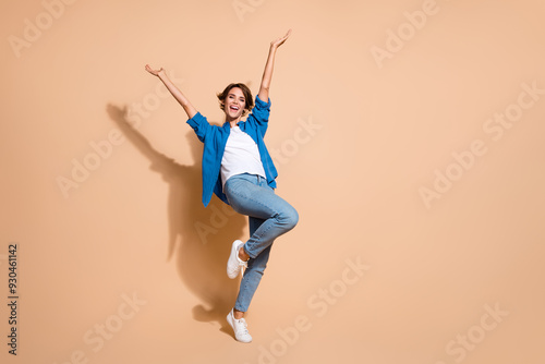 Full body size photo of overjoyed young business woman celebrate corporate party biggest profit in year isolated on beige color background