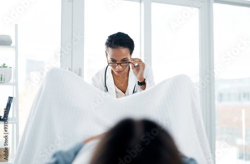 Gynecology, doctor and woman with checkup at clinic for pelvic exam, pap smear and vaginal examination. Gynaecologist, patient and medical assessment, pregnancy planning and stirrups at hospital care