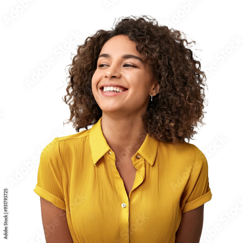 Closeup portrait of a beautiful African American woman with curly hair wearing a plain yellow shirt smiling and looking up