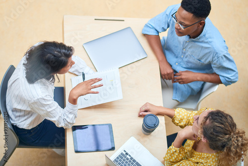 Document, meeting and business people with manager in office for performance review on probation. Discussion, paperwork and mentor with public relations team for project feedback from above.