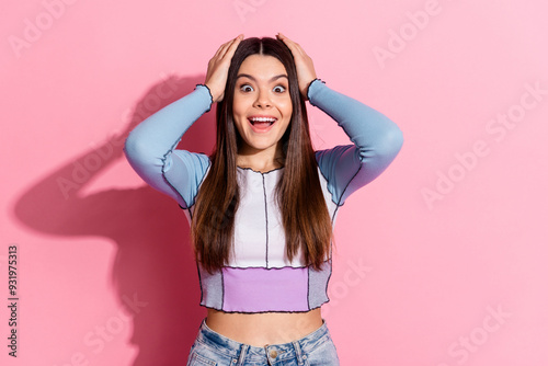 Photo of charming lovely cute girl arm touch head wear blue stylish clothes isolated on pink color background