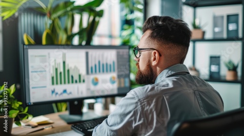 A manager reviewing performance metrics and KPIs on a computer screen.