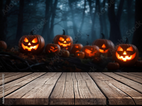 Wooden table and blurred Empty Halloween night background. Tombs. Bats. Pumpkins. Blank of Halloween for the Product. Advertise. Mockup. Copy Space.