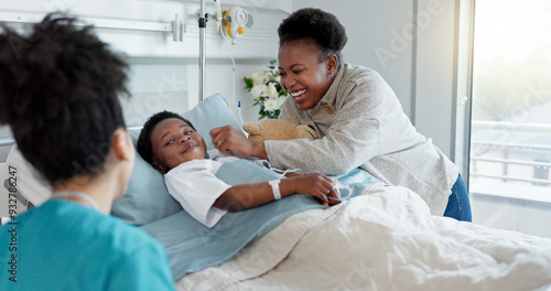 Mom, nurse and black child patient in hospital for recovery of surgery for congenital heart disease. Checkup, sick and cardiology medical worker with happy mother and kid for postoperative care.