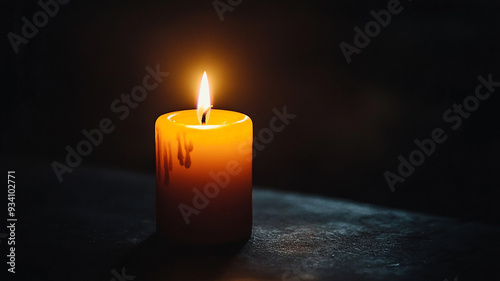 Two burning candles on dark surface with blurred lights.