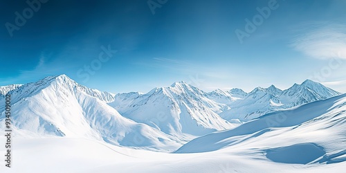 Wide angle view landscape of white snowy mountains range with clear blue sky during cold winter. Nature concept for extreme lifestyle product background 