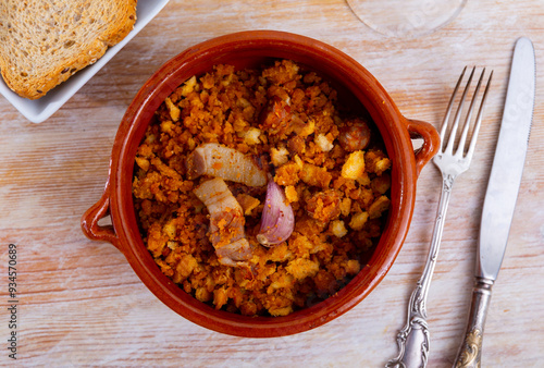 Spanish dish migas with bread crumbs served in bowl