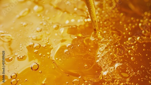 Golden liquid flowing with bubbles rising, reminiscent of honey or syrup, surrounded by a warm, glowing ambiance.