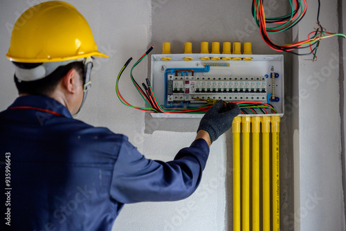 An electrician or an electrical engineer Install and test outlets and switches for electricity in houses and buildings.