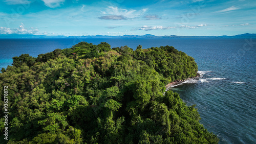 Aerial view of lush greenery on Nosy Tanikely Island, Madagascar, showcasing the vibrant coastline and surrounding waters