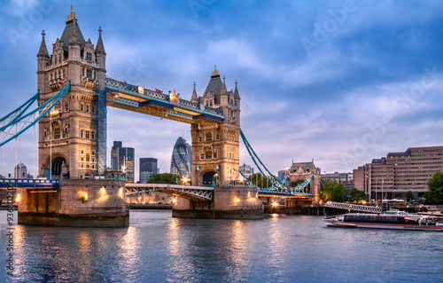 Tower Bridge in London UK at dusk. Tower Bridge is a combined bascule, suspension, and, until 1960, cantilever bridge in London, built between 1886 and 1894.