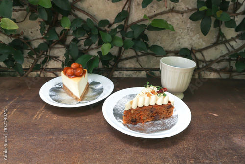 carrot cake with cream and walnut topping ,caramel macadamia cheesecake and hot tea