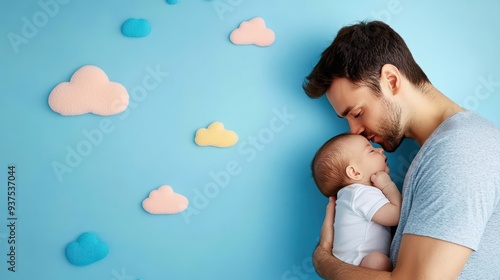 A father burping his newborn, holding the baby close and comforting him.