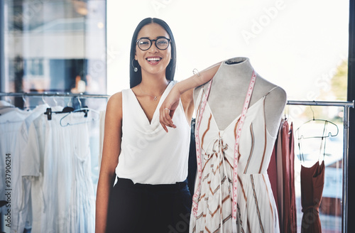 Happy woman, portrait and fashion designer with mannequin in confidence for small business at boutique. Young, female person or tailor with smile or measuring tape for garment or clothing production