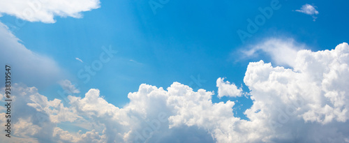 Blue sky with white curly clouds