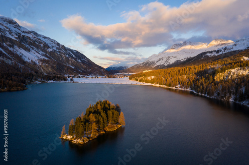 Lake Sils, Switzerland: Dramatic aerial view of the sunset over the Silsersee lake in winter in the Engadine valley in Canton Graubunden in the Swiss alps.