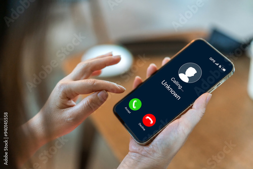 Human use smartphone with incoming call from unknown number, spam, prank caller, hoax person, fake identity, scammer, scam with mobile phone, hacker, call center, crime, call, fraud or phishing.