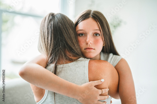 Worried teen with mother consoling share problem with someone close concept