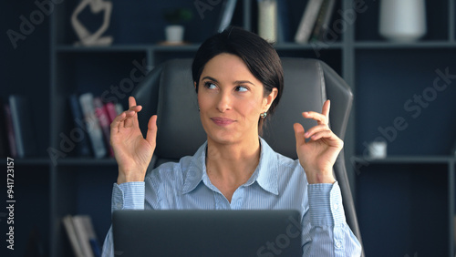 Businesswoman scheming and plotting at office desk