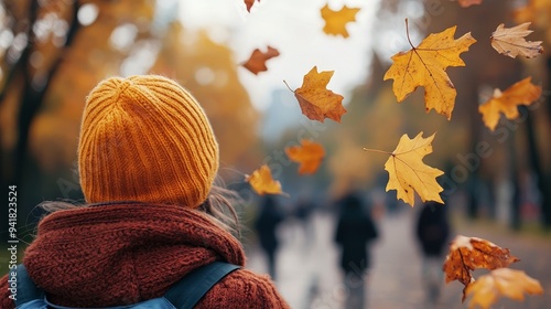 A brisk, windy autumn day with leaves swirling through the air and people bundled up in warm clothing