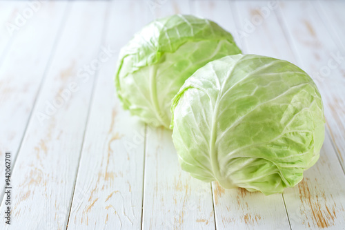 fresh cabbage on a light wooden table, selective focus.