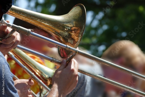 Street musician playing trombone during parade