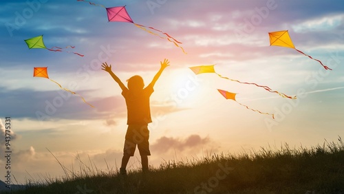 Child's Joyful Silhouette Against a Colorful Sunset Sky