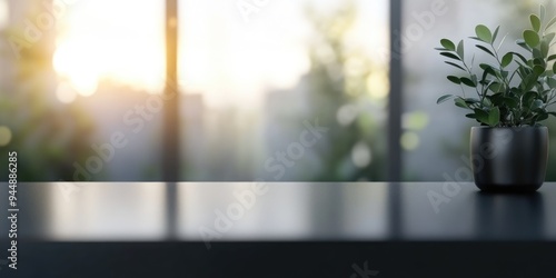 3D rendering of a blurred gray background with a black desk space