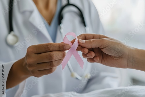 Healthcare Professional Support: A caring doctor or nurse in a white coat gently placing a pink ribbon pin on a patient's gown. The focus should be on the hands and the ribbon, with the patient and pr