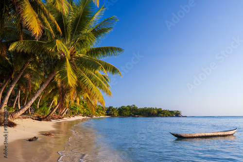 Beach and traditional fishing pirogue, ile aux Nattes (Sainte Marie), Madagascar.