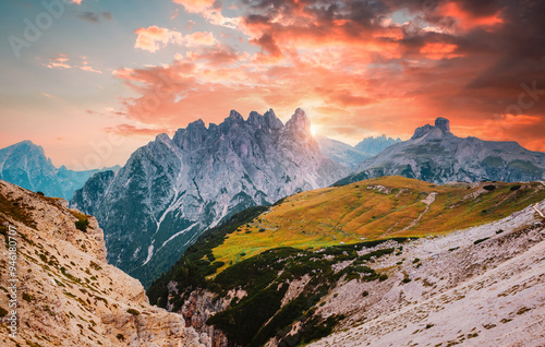 Mountainous terrain with a rocky massif in the Italian Alps in the early morning. South Tyrol, Europe.