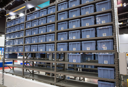 Vertical storage ergonomic solution. Automated storage and retrieval system. Modern industrial warehouse. 