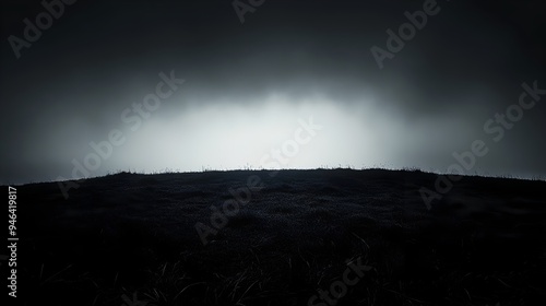 A conceptual image depicting the darkness creeping over a tranquil landscape with the light gradually fading away leaving only silhouetted forms and ample copy space for text or design elements