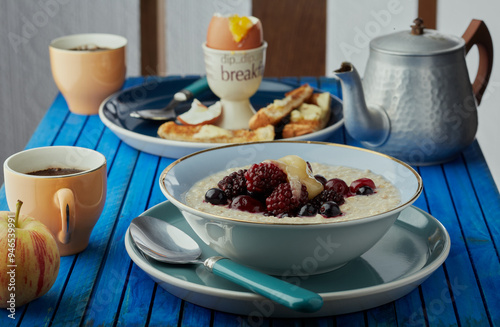 Breakfast table with food and beverages.