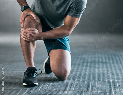 Man, hands and knee pain with injury in muscle tension, accident or fitness on floor at gym. Closeup of male person with sore leg, ache or inflammation in strain, pressure or sprain at health club