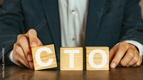 There is wood cube with the word CTO. It is an abbreviation for Chief Technology Officer as eye-catching image.