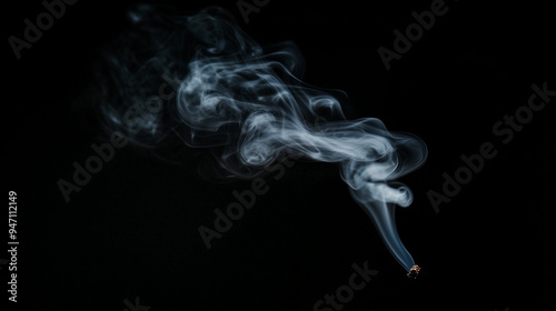 A small wisp of smoke against a black background 