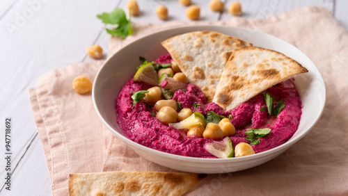 Close-up of Beetroot hummus on white table