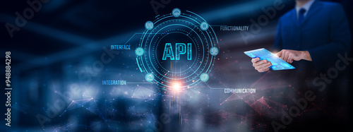 API: Businessman using tablet analyzing API record on tablet. Digital integration and network connection on modern virtual screen interface, data exchange, automation, technology and network.